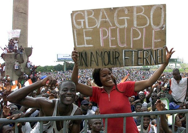 692210_protesters-holding-a-poster-reading-gbagbo-the-people-love-you-for-ever-as-they-take-part-in-a-d.jpg