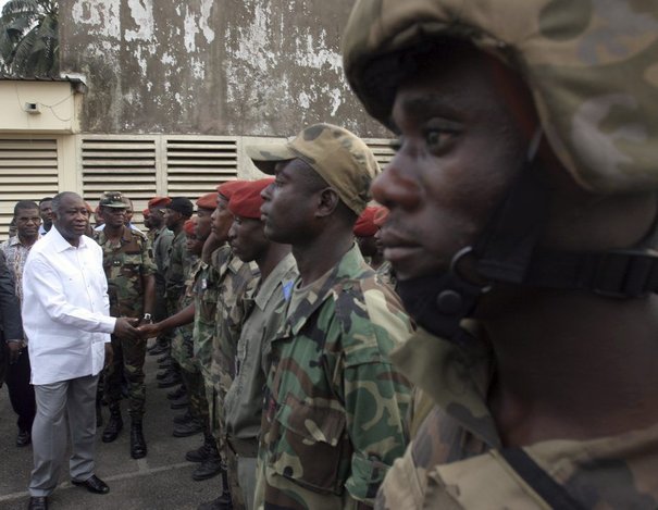 692224_ivory-coast-s-president-gbagbo-congratulates-soldiers-after-an-attack-on-a-military-base-in-the-eastern-akouedo-district-in-abidjan.jpg
