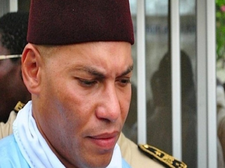 Karim Wade doit payer sa dette ou retourner en prison (ministre)