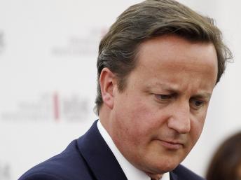 Le Premier ministre britannique David Cameron, mis en cause dans le scandale des écoutes, va abréger son voyage en Afrique. REUTERS/Christopher Furlong/Pool