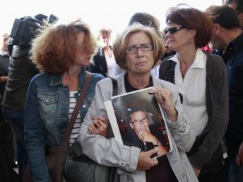 Les familles des dix-sept victimes de l'attentat du 28 avril 2011ont assisté au procès des neuf auteurs présumés. REUTERS/Stringer