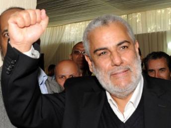 Abdelilah Benkirane, le secrétaire général du Parti justice et développement fête la victoire au siège de son parti, à Rabat. AFP/Abdelhak SENNA