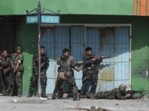 Zamboanga, dans le sud des Philippines, le 12 septembre 2013. Bataille rangée entre les forces gouvernementales et les rebelles du Milf.tember 12, 2013. REUTERS/Erik De Castro