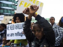 Manifestation d'immigrés africains demandant le statut de réfugiés et la liberté de travailler, à Tel Aviv le 15 janvier 2014. REUTERS/Ronen Zvulun