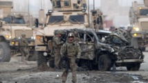 Les militaires américains sur le lieu de l'attentat à la voiture piégée à Kaboul, le 10 février 2014. REUTERS/Mohammad Ismail