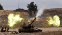 Une unité d'artillerie israélienne faisant feu sur la bande de Gaza, le 18 juillet 2014. REUTERS/Nir Elias
