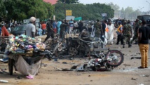 Une rue de Kaduna dévastée après le double attentat meurtrier, le 23 juillet 2014 AFP PHOTO / VICTOR ULASI