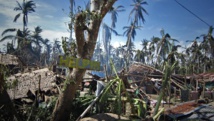Maisons détruites dans le village de Mantang au centre des Philippines. AFP Maisons détruites dans le village de Mantang au centre des Philippines. AFP