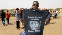 Un manifestant burkinabè présent à la cérémonie du souvenir de Norbert Zongo, le 13 décembre 2014, à Ouagadougou. Yaya Boudani / RFI
