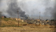Vue générale de la ville de Sinjar lors d'affrontements le 22 décembre 2014. REUTERS/Stringer Vue générale de la ville de Sinjar lors d'affrontements le 22 décembre 2014. REUTERS/Stringer
