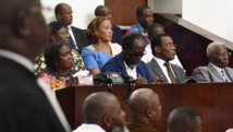Au premier rang, l'ex-Première dame de Côte d'Ivoire Simone Gbagbo, l'ex-Premier ministre Ake N'Gbo, le président du FPI Pascal Affi N'Guessan et le vice-président du FPI Aboudramane Sangare, à l'ouverture de leur procès à Abidjan, le 26 décembre 2014. AFP PHOTO / SIA KAMBOU