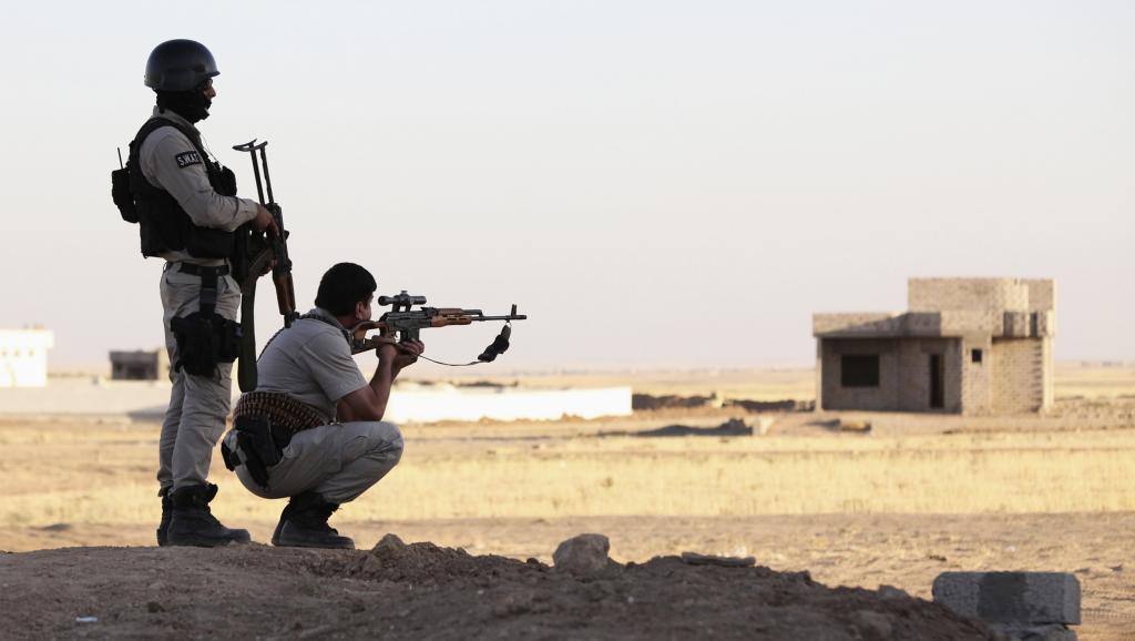 Deux pershmergas dans la province de Ninive, en Irak, le 9 août 2014. REUTERS/Ari Jalal