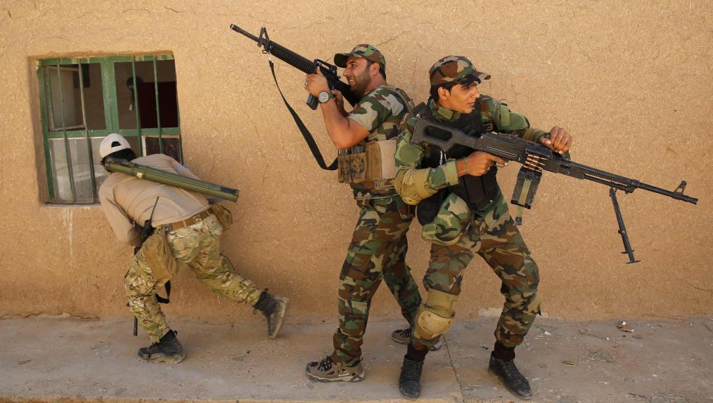 Entraînement de la milice chiite de l'armée du Mahdi, près de Tikrit, en Irak, avant d'affronter l'organisation Etat islamique. REUTERS/Ahmed Jadallah
