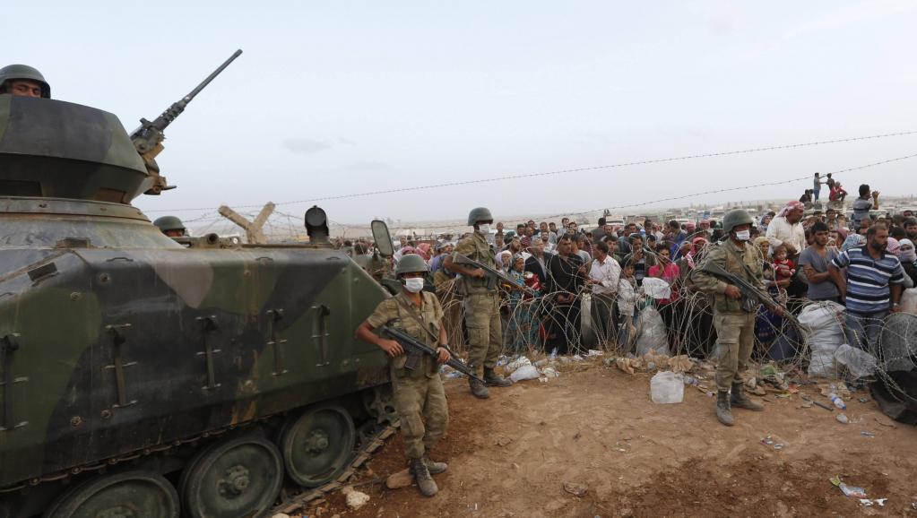 Militaires turcs à la frontière avec la Syrie le 27 septembre 2014. REUTERS/Murad Sezer