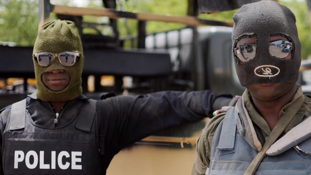Des policiers nigérians, à Maiduguri, dans l'Etat de Borno, au Nigeria, lors d'une opération contre Boko Haram en juin 2013. AFP PHOTO / Quentin Leboucher