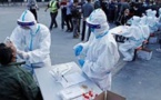 Covid-19 : des millions de personnes confinées en Chine face à une flambée des cas